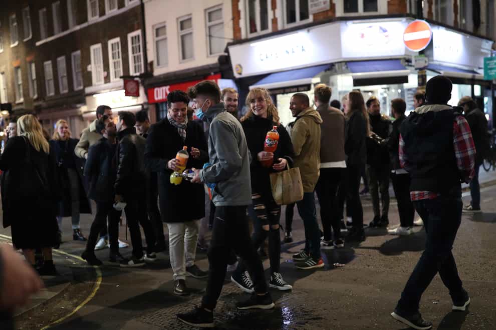 People in Soho, London, after pubs and restaurants were subject to a 10pm curfew