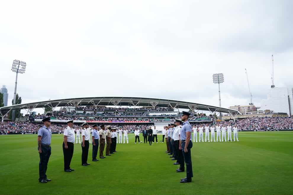 England players observe a minute’s silence on day three of the third LV= Insurance Test match at the Kia Oval (John Walton/PA)