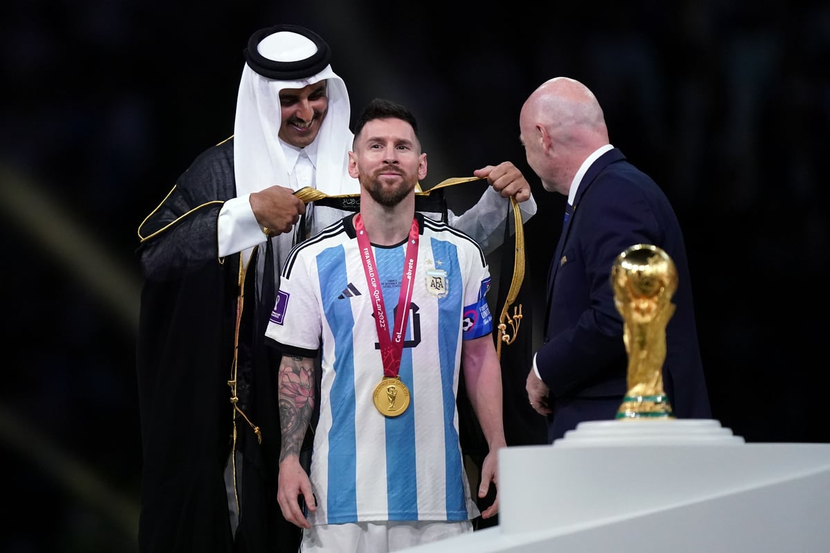 Lionel Messi forced to cover Argentina shirt to lift World Cup trophy as  Gary Lineker rages - Mirror Online