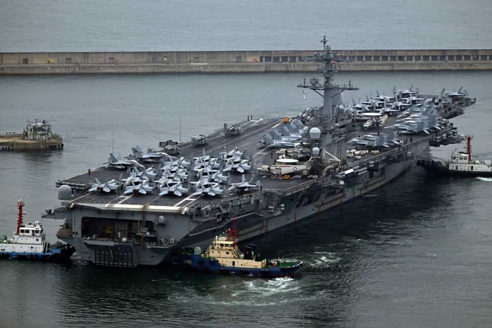 The Theodore Roosevelt (CVN 71), a nuclear-powered aircraft carrier is anchored in Busan, South Korea (Song Kyung-Seok/Pool Photo via AP)