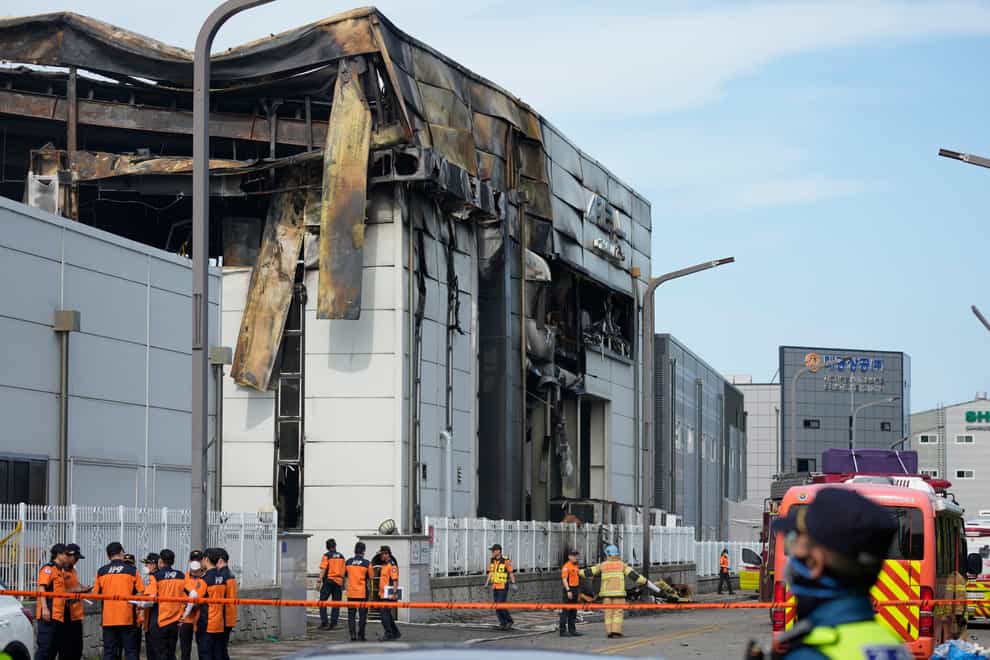Investigators were combing through the charred ruins of a factory building near South Korea’s capital on Tuesday to find the cause of a devastating fire that killed 23 people (Lee Jin-man/AP)